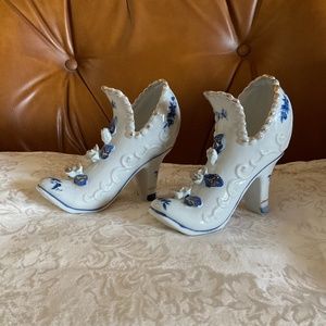 Vintage porcelain shoes, 5” high, embellished with blue, white & gold accents
